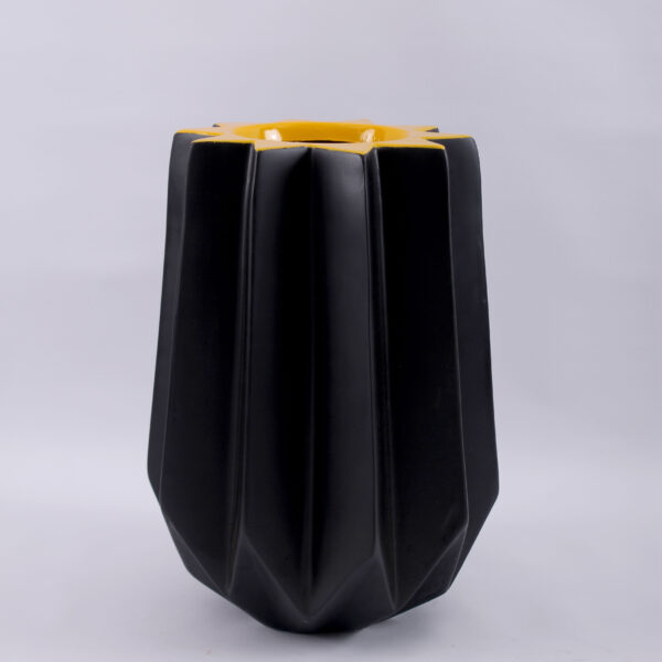 A fiberglass planter featuring a sleek and modern design, enhancing the beauty and durability of your plants in both residential and commercial settings.